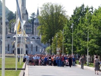 Christians marching in a procession at Lourdes.